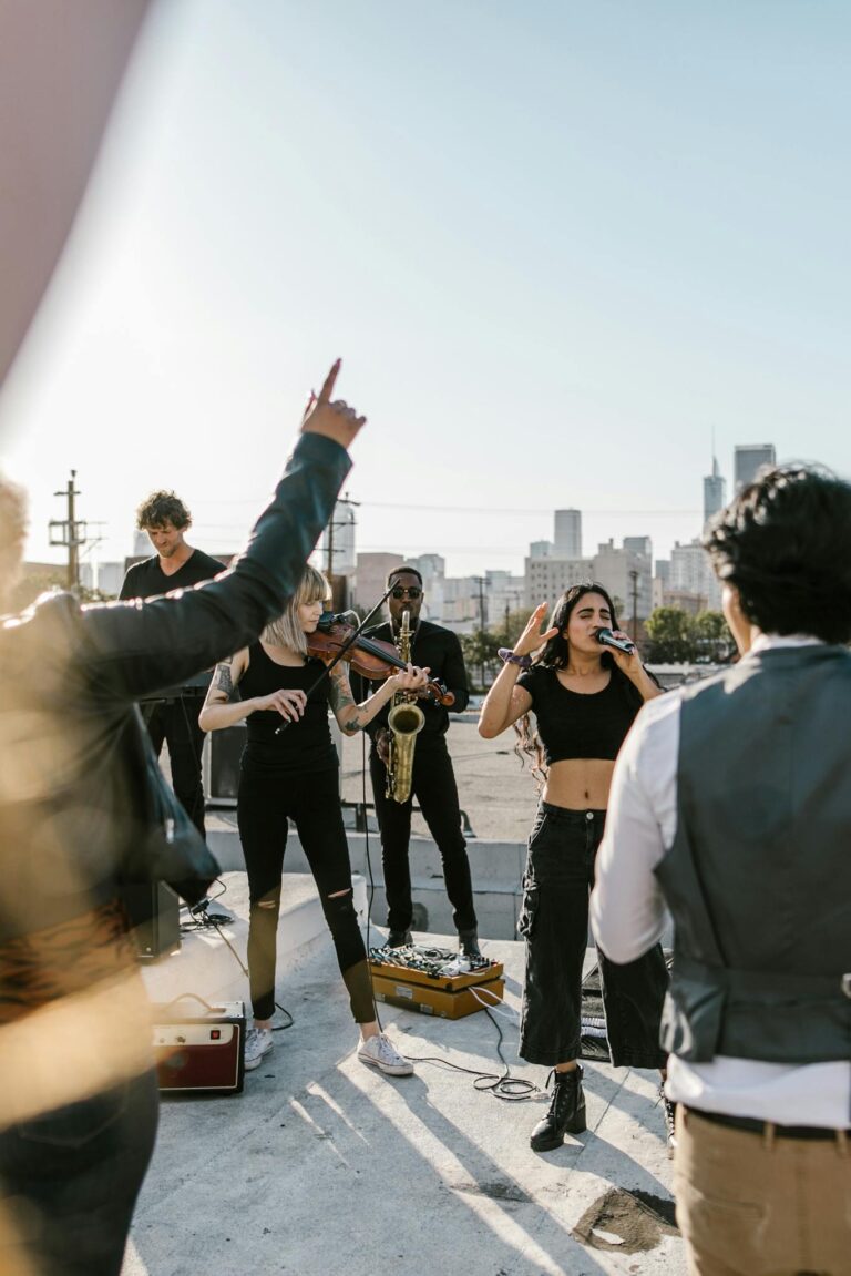 People Watching a Band in a Live Performance on the Street